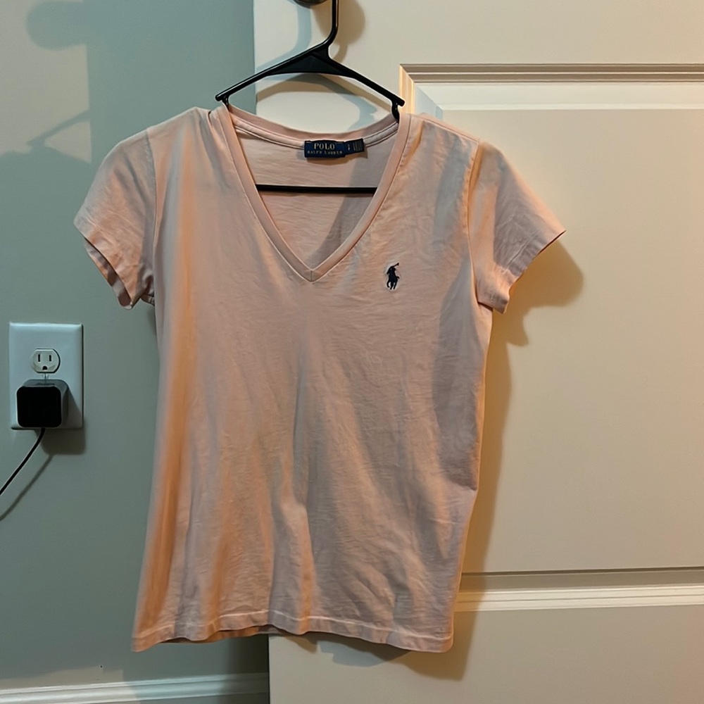 Small pink polo shirt perfect condition.